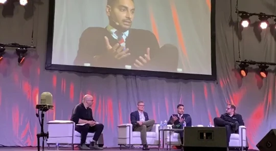 Dr. S speaking on a panel at a conference